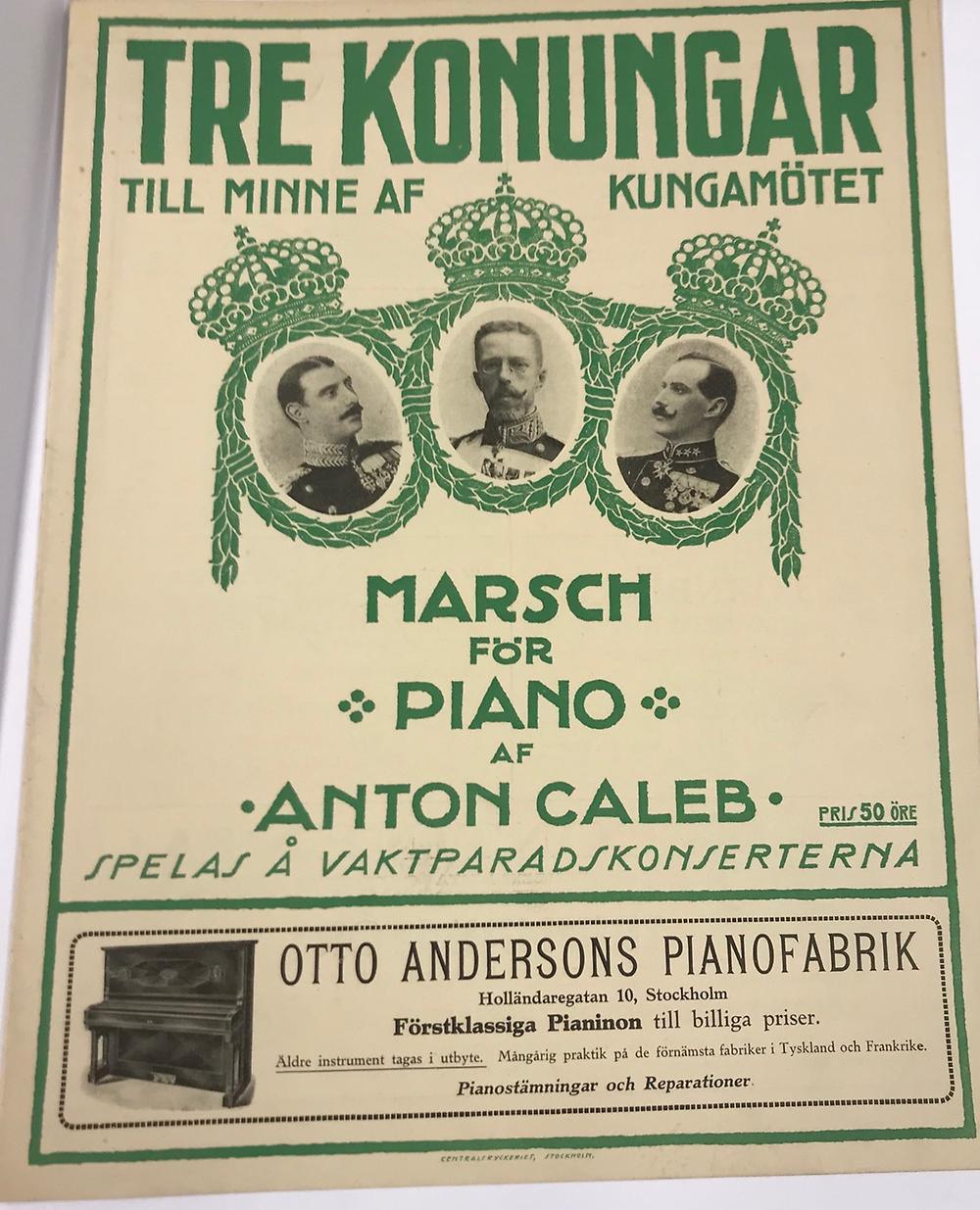 Musiktrycket "Tre konungar, marsch för piano av Anton Caleb" med tre kungaporträtt, varav ett av Gustav V