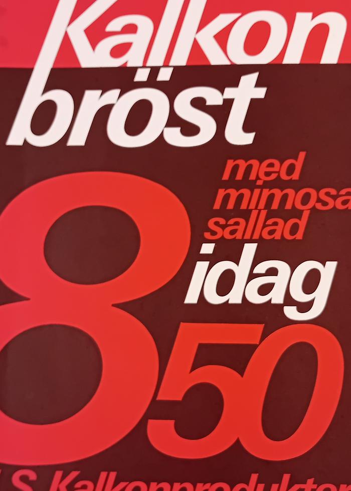 Affärstryck i röda nyanser och vitt.