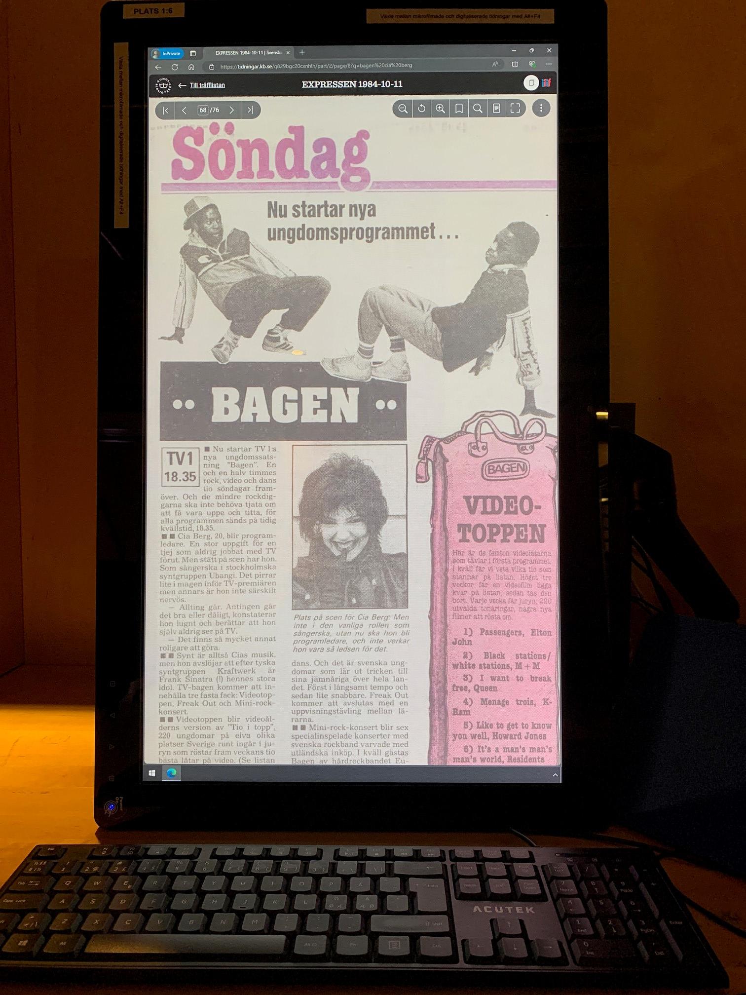 Datorskärm med del av en tidningssida med texten "Nu startar nya ungdomsprogrammet Bagen". Två yngre män i träningskläder dansar breakdance. På sidan finns också en bild med ansiktet på en leende kvinna med mörk pagefrisyr.