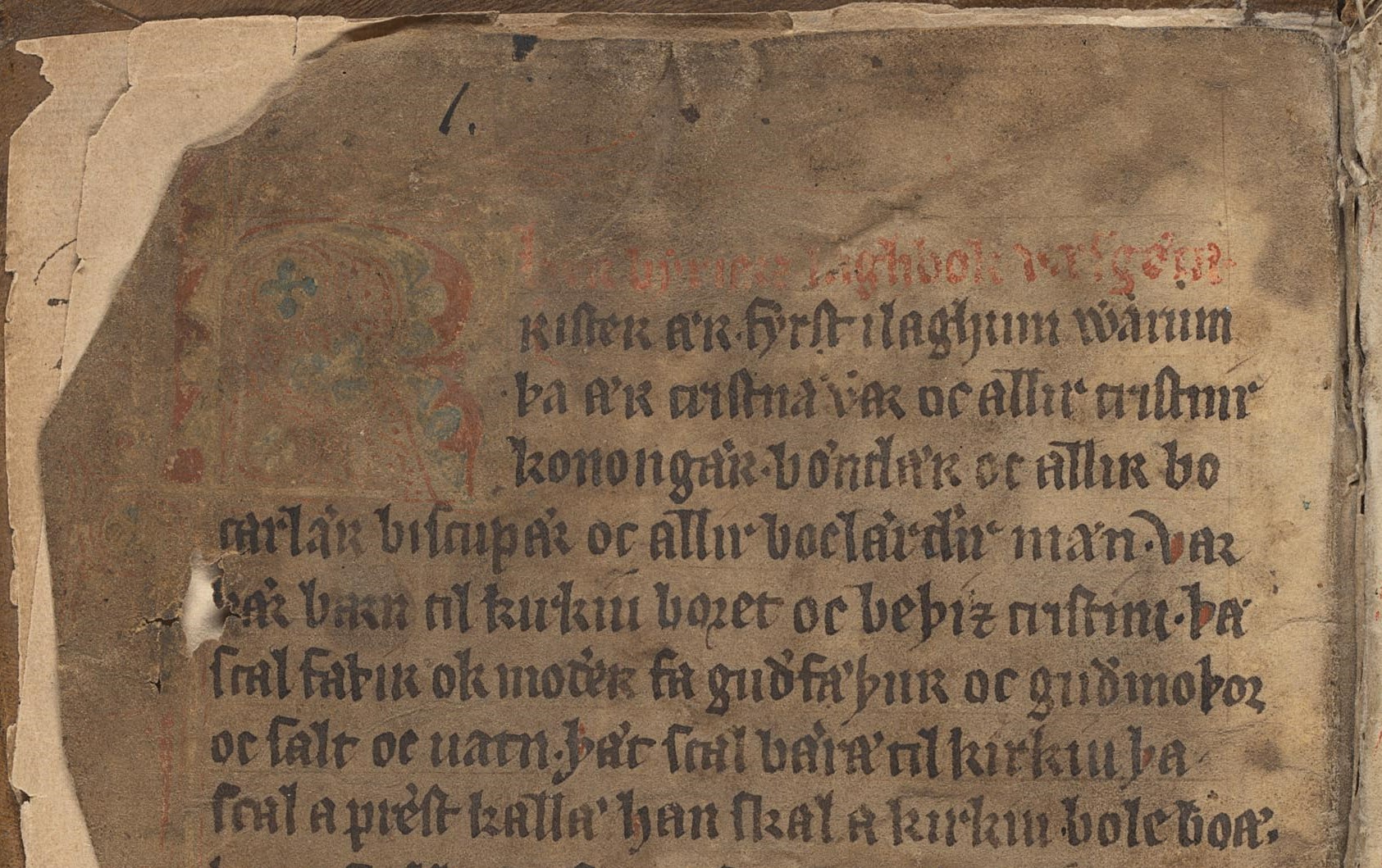 Handskriven gammalsvensk text på pergament, längst till vänster ett stort K.