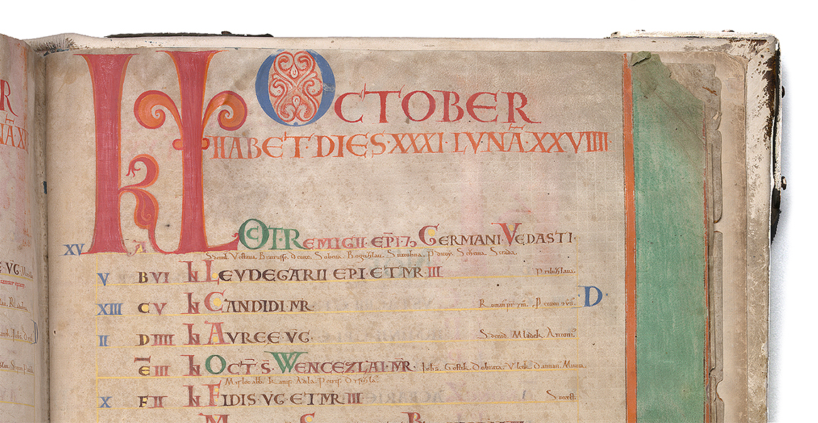 Writing in latin in the colors red and green. On topof the page the word October.