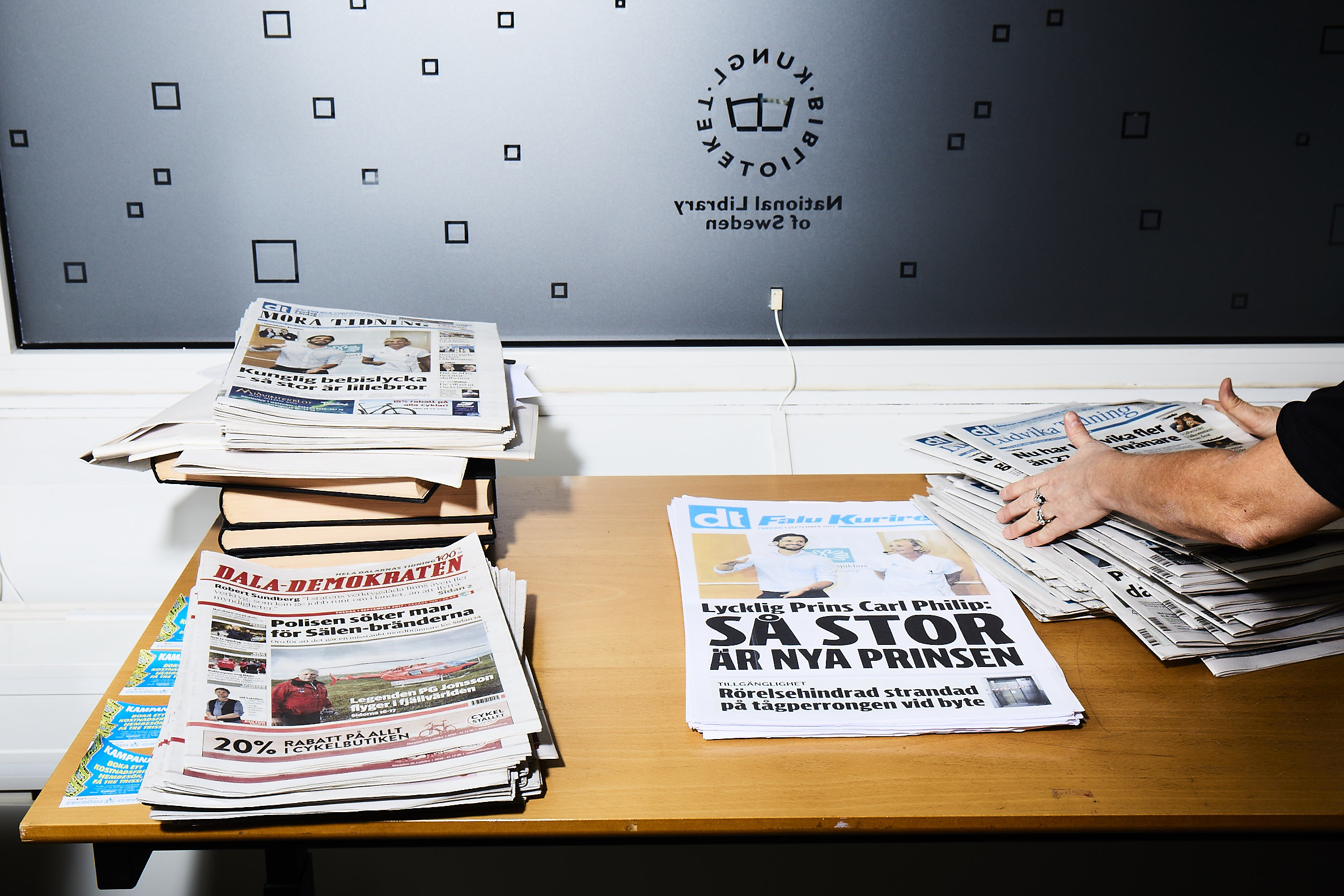 Newspapers on a table.
