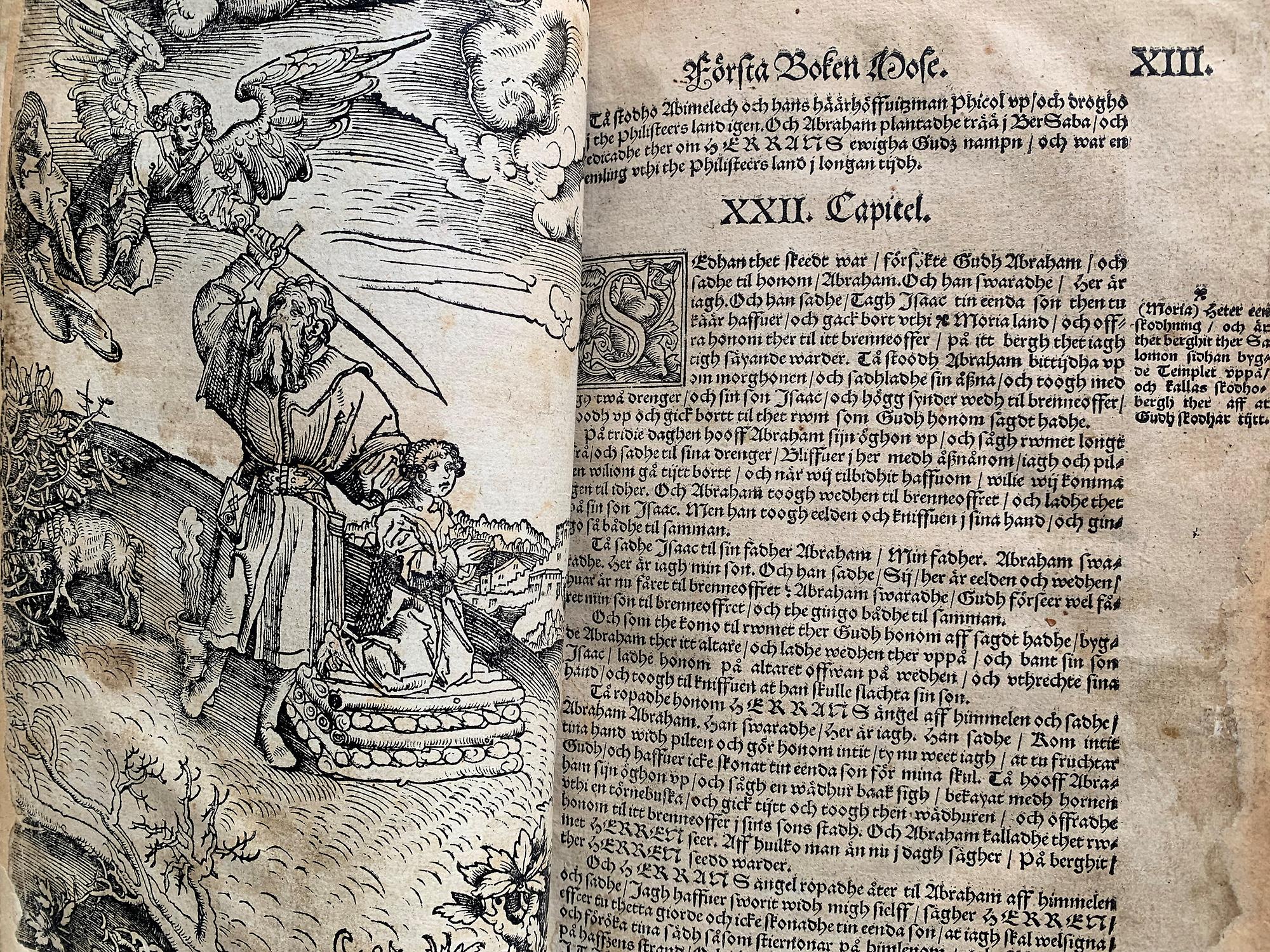 Ett uppslag ur Gustav Vasas bibel från 1541. Vänstra sidan visar ett träsnitt föreställande Abrahams offer.