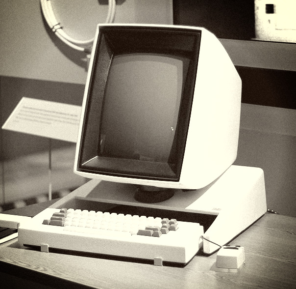 Old desktop computer, white and cube-like.