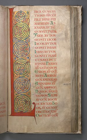 A book page with the letter L with colorful ornamentation. 
