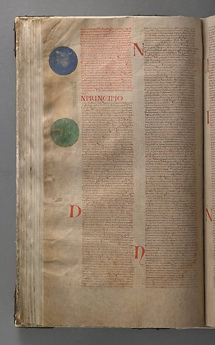 A book page with text and two circles in green and blue in the margin. 