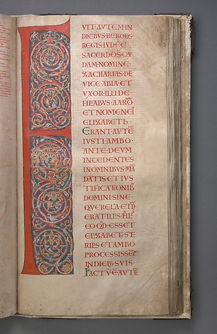 A book page with the letter F with red and blue ornamentation. 