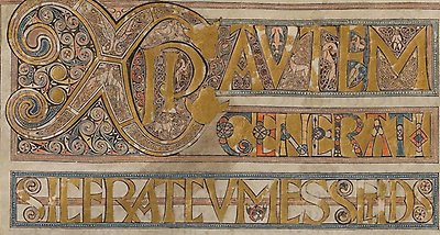 Ancient manuscript with golden letters.